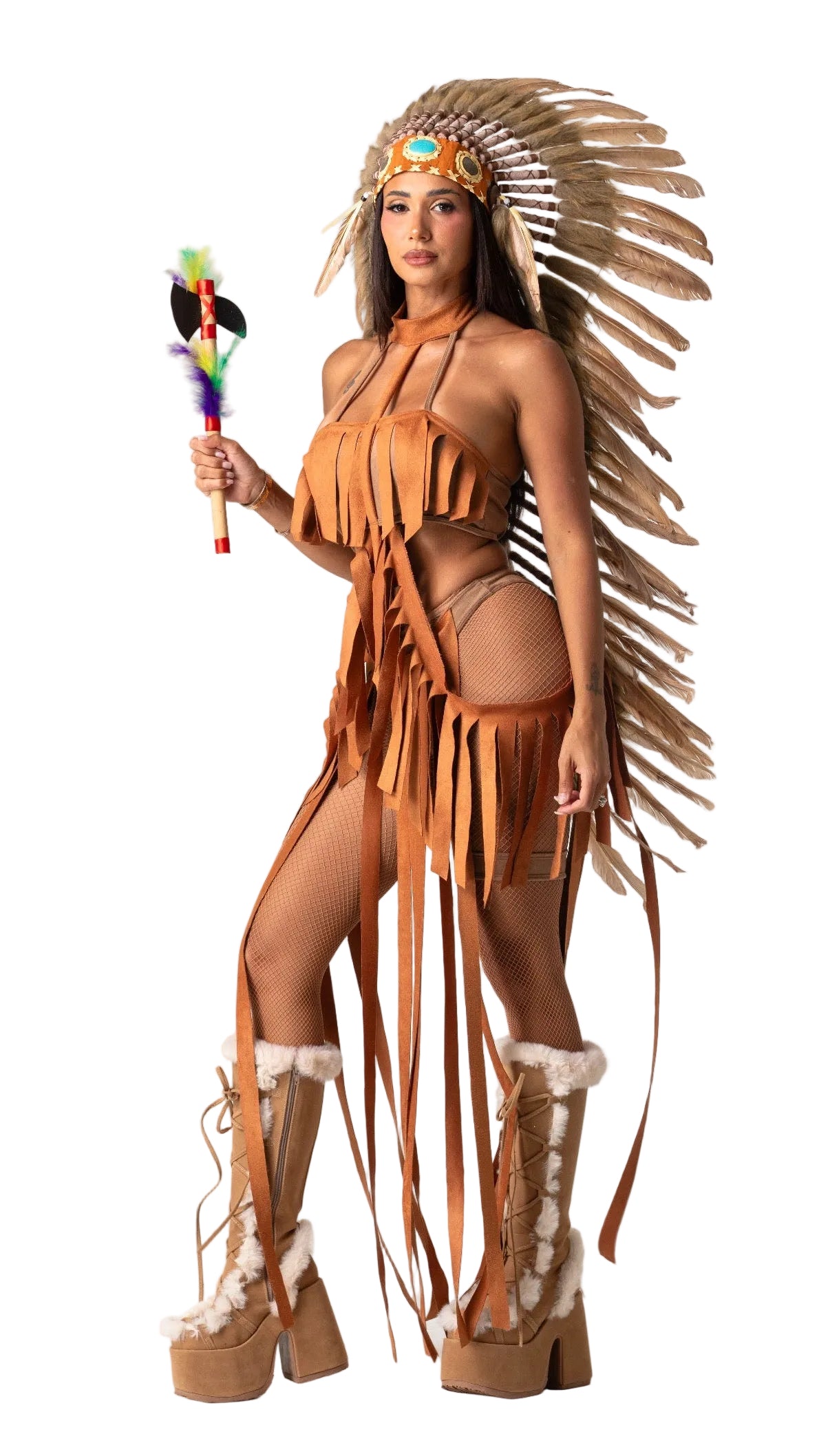 A woman modeling a Native American-inspired costume consisting of a tan fringed halter top, matching fringed shorts, a large feathered headdress, and tall fringed platform boots, holding a small feathered wand against a plain white studio background.